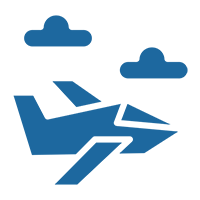 A blue airplane flying through the sky with clouds.