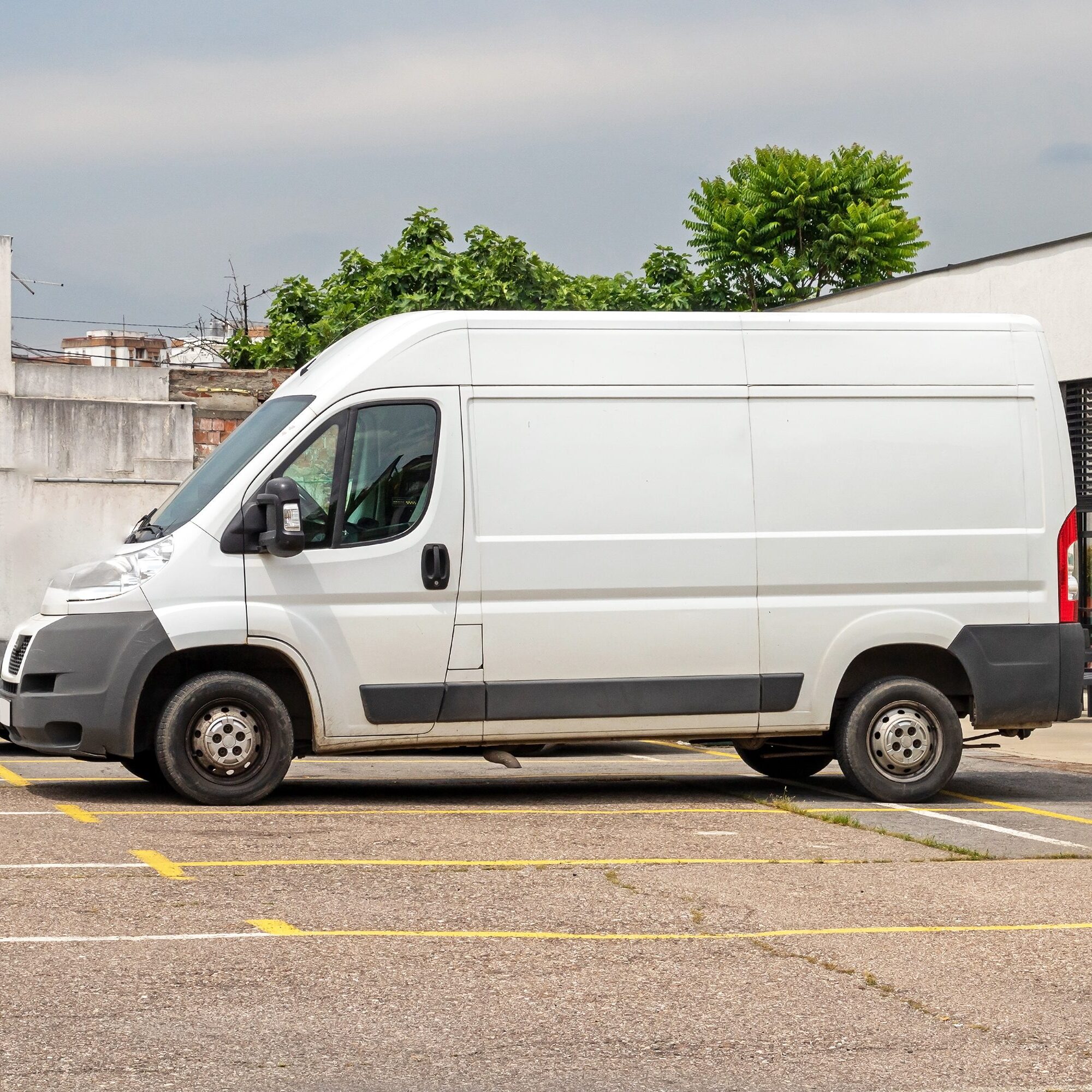 A white van parked in the parking lot.