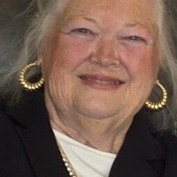 Resized_20241107_122933_1731022402664 A woman with long white hair wearing gold jewelry.