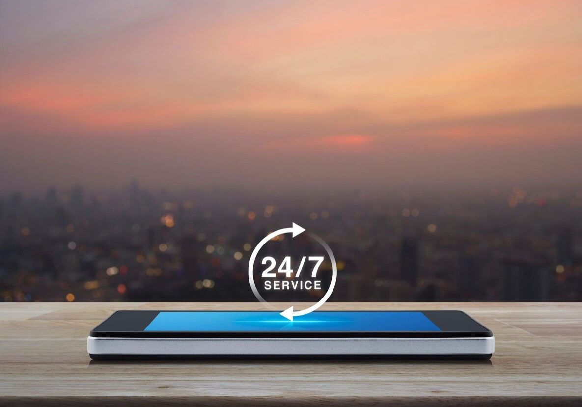 A tablet with the words 2 4 / 7 service on it.