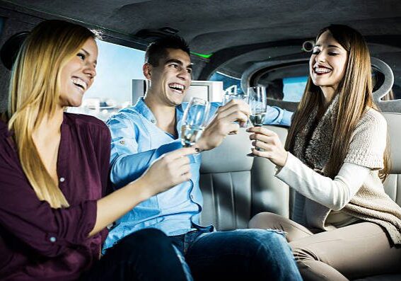 istockphoto-471899545-612x612 A group of people sitting in the back of a car.